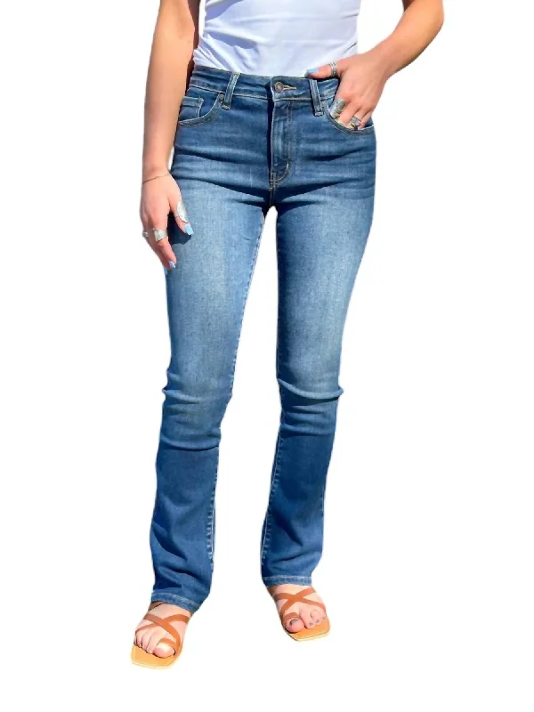 Ripped women jeans for a rebellious and fashion - forward styleHigh Rise Bootcut Jeans In Medium Rinse Ripped women jeans for a rebellious and fashion - forward styleHigh Rise Bootcut Jeans In Medium Rinse