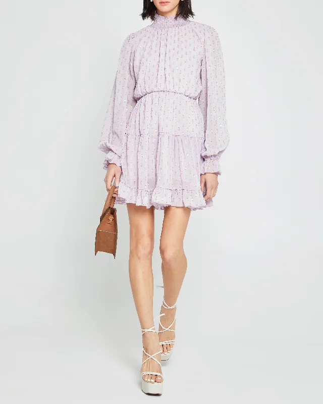 Midi dresses with fringe details for a fun and energetic styleLluvia Dress