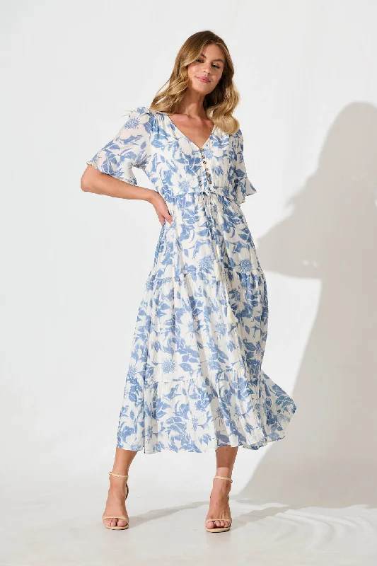 Sheer maxi dresses with lace overlays for a romantic touchChavira Maxi Dress in White with Blue Flower