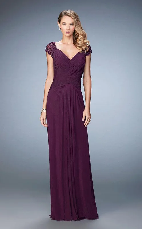 Wedding guest dresses with cold - shoulder ruffled sleeves and knee - length hemsLa Femme Lace Cap Sleeve Weaved Cutout Back Jersey Gown 23084SC